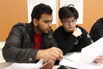 Carlos Acuna and Paolo Maralit, left to right, work together during an accelerated English course at Skyline College in San Bruno, Calif., on Tuesday, Sept. 20, 2016. This English 105 course allows students who otherwise might be placed in remedial English to earn transferable college credits. (Gary Reyes/Bay Area News Group)